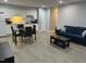 Living room with a dining room featuring white kitchen cabinets and an open floorplan at 130 S Estes Dr # C-5, Chapel Hill, NC 27514