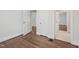 This bedroom features hardwood floors and white doors and trim throughout at 1316 Glenwood Ave, Raleigh, NC 27605