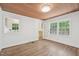 Bright dining room featuring a beautiful wood ceiling and large windows that fill the room with natural light at 1316 Glenwood Ave, Raleigh, NC 27605