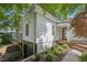 This home features a convenient drive-under garage and beautifully landscaped yard with mature trees at 1316 Glenwood Ave, Raleigh, NC 27605