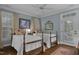 Cozy bedroom with wood floors, two twin beds, and natural light at 1501 Samuel Wait Ln, Wake Forest, NC 27587