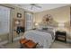 Comfortable bedroom with neutral walls, plush bedding, and a window with plantation shutters allowing natural light at 1501 Samuel Wait Ln, Wake Forest, NC 27587