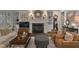 Cozy living room boasts built-in shelves, a fireplace, and comfortable seating at 1501 Samuel Wait Ln, Wake Forest, NC 27587