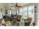 Relaxing screened-in porch with ceiling fans, comfortable seating and views of the lush, green, treelined yard at 1501 Samuel Wait Ln, Wake Forest, NC 27587