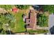 Overhead view of home with fenced backyard, fire pit area, plus small outbuilding and garden at 1612 Regency Dr, Burlington, NC 27215