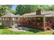 Backyard with gazebo, fire pit, and deck is perfect for outdoor gatherings and relaxation at 1612 Regency Dr, Burlington, NC 27215