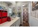 Functional bathroom showcasing a large mirror and a shower with a decorative curtain at 1612 Regency Dr, Burlington, NC 27215