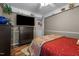 Cozy bedroom featuring a mounted television and wood-look flooring at 1612 Regency Dr, Burlington, NC 27215