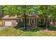 Charming brick home with mature trees and a well-manicured lawn at 1612 Regency Dr, Burlington, NC 27215