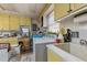 Practical laundry room with built-in cabinets and a utility sink at 1612 Regency Dr, Burlington, NC 27215