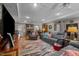 Cozy living room with a brick fireplace, comfortable seating, and hardwood floors at 1612 Regency Dr, Burlington, NC 27215