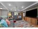 Bright living room featuring comfortable seating, a ceiling fan, and hardwood floors at 1612 Regency Dr, Burlington, NC 27215