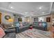 Spacious living room with comfortable seating, a colorful rug, and hardwood floors at 1612 Regency Dr, Burlington, NC 27215