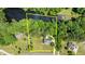 Drone shot featuring a brick home near a river and bordered by lush trees at 170 Homestead Rd, Angier, NC 27501