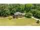 Aerial view of a brick home with mature landscaping and a sprawling lawn at 170 Homestead Rd, Angier, NC 27501
