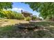 Expansive backyard showcasing lush landscaping and multi-level deck, a fire pit area at 170 Homestead Rd, Angier, NC 27501