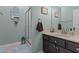 Inviting bathroom featuring framed art, glass shower, and vanity with decorative hardware at 170 Homestead Rd, Angier, NC 27501