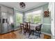 Cozy breakfast nook featuring a view of the outdoor scenery and a stainless steel refrigerator at 170 Homestead Rd, Angier, NC 27501