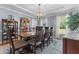 Elegant dining room features a large table, chandelier, and ample natural light at 170 Homestead Rd, Angier, NC 27501
