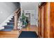 Bright foyer with hardwood floors, staircase, and a glimpse into other rooms at 170 Homestead Rd, Angier, NC 27501