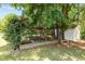 Wooden framed raised garden beds with climbing plants, near a white shed and mature trees at 170 Homestead Rd, Angier, NC 27501