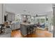 Spacious kitchen features gray cabinetry, granite countertops, and a breakfast bar with seating at 170 Homestead Rd, Angier, NC 27501