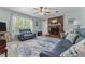 Spacious living room featuring a brick fireplace and bright windows with natural light at 170 Homestead Rd, Angier, NC 27501