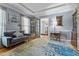 Comfortable living room featuring hardwood floors, modern sofa, and decorative touches at 170 Homestead Rd, Angier, NC 27501