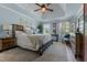 Large main bedroom featuring high ceilings, natural lighting, and wooden furniture at 170 Homestead Rd, Angier, NC 27501