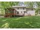 Exterior view of a backyard with a deck and screened-in porch at 1705 Bridgeport Dr, Raleigh, NC 27615