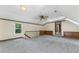 Spacious bonus room with wood trim, neutral walls, carpeted floor, and ample natural light at 1705 Bridgeport Dr, Raleigh, NC 27615