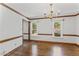 Dining area with hardwood floors, light walls, chandelier, and natural light at 1705 Bridgeport Dr, Raleigh, NC 27615