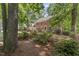 Brick home with manicured landscaping and mature trees at 1705 Bridgeport Dr, Raleigh, NC 27615