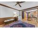 Comfortable living room featuring stylish rug, wood trim, ceiling fan, and an eat-in kitchen at 1705 Bridgeport Dr, Raleigh, NC 27615