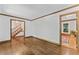 Spacious living room featuring hardwood flooring, light walls, and wood trim at 1705 Bridgeport Dr, Raleigh, NC 27615