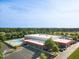 Aerial view of the community, highlighting the swimming pool, tennis courts, and surrounding green spaces at 1826 Heisser Ln, Fuquay Varina, NC 27526