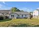 Large backyard with a spacious lawn, patio, and play set - perfect for outdoor living and entertaining at 1826 Heisser Ln, Fuquay Varina, NC 27526