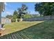 Spacious backyard featuring a well-maintained lawn, mature trees and a privacy fence, offering a serene outdoor space at 1826 Heisser Ln, Fuquay Varina, NC 27526