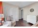 A Bedroom with hardwood floors, a comfortable chair, and closet for ample storage at 1826 Heisser Ln, Fuquay Varina, NC 27526