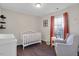 Lovely Bedroom with a cozy chair, changing table, and a bright window for a happy space at 1826 Heisser Ln, Fuquay Varina, NC 27526