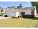 Charming home with a two-car garage, well-kept lawn, and mature landscaping at 1826 Heisser Ln, Fuquay Varina, NC 27526