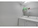 Convenient laundry room with modern washer and dryer and storage shelving at 1826 Heisser Ln, Fuquay Varina, NC 27526