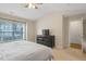 The main bedroom is complete with a TV and a large window for plenty of natural light at 1826 Heisser Ln, Fuquay Varina, NC 27526