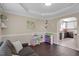 Playroom with hardwood floors and cheerful decorations adjacent to the kitchen at 1826 Heisser Ln, Fuquay Varina, NC 27526