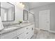 Bright bathroom features double vanity, granite counters, and tiled walk-in shower at 1840 Willie Pace Rd, Burlington, NC 27217