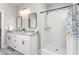 Bright bathroom featuring double vanity, granite countertops, and white tiled walk-in shower at 1840 Willie Pace Rd, Burlington, NC 27217