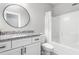 Well-lit bathroom features granite countertop, under-mount sink, and shower-tub combination at 1840 Willie Pace Rd, Burlington, NC 27217