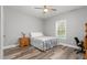 Cozy bedroom with neutral tones, ceiling fan, and natural light from window at 1840 Willie Pace Rd, Burlington, NC 27217