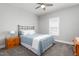 Comfortable bedroom features ceiling fan, neutral walls, and carpet flooring at 1840 Willie Pace Rd, Burlington, NC 27217