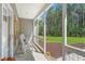 Charming front porch with rocking chairs, providing a serene view of the lush, green surroundings at 1840 Willie Pace Rd, Burlington, NC 27217